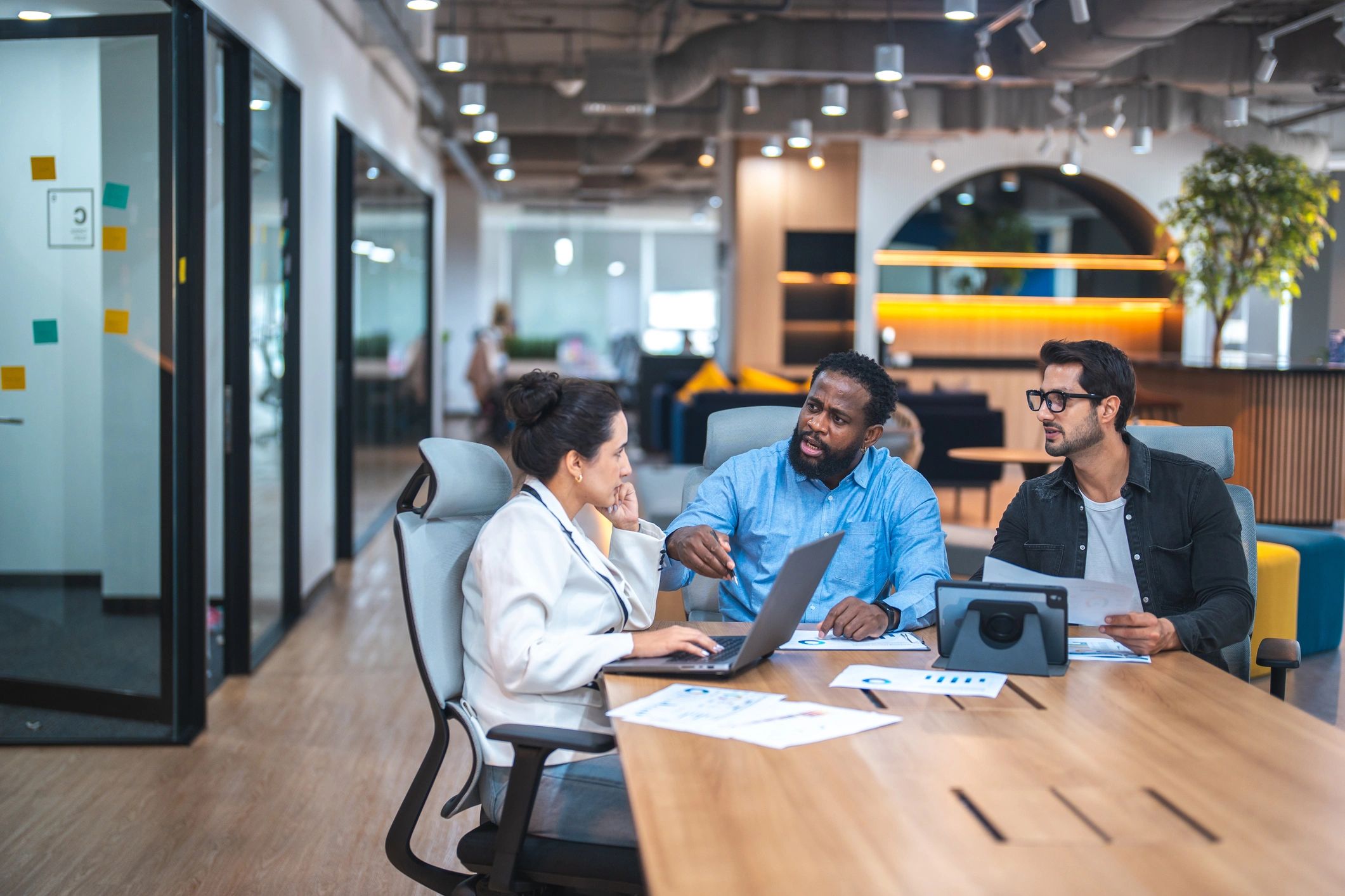 Team of IT consultants collaborating in a modern office